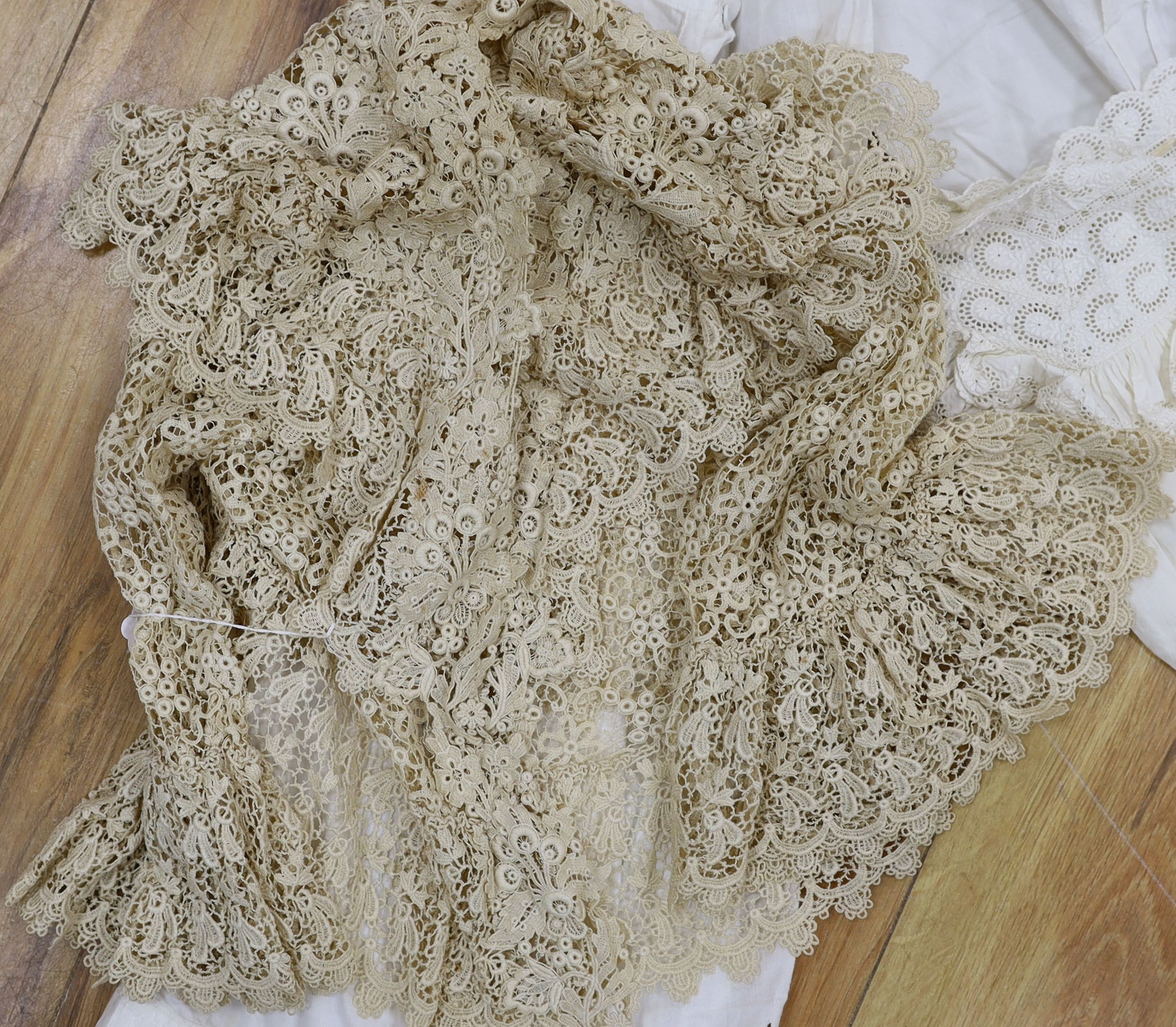 Five Victorian and Edwardian lace inserted camisole tops, a cream chemical lace jacket and a whitework and lace petticoat